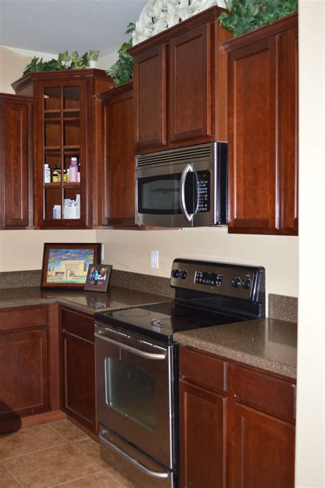 mocha or mahogony cabinets with stainless steel appliances|appliance matching cabinets.